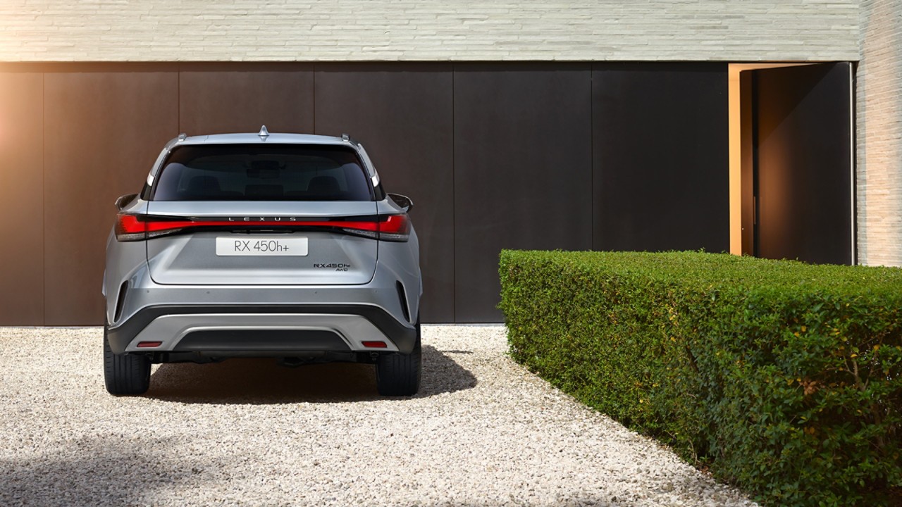 A Lexus RX 500h parked outside a building