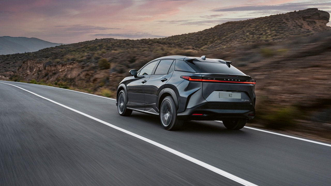 Rear view of the Lexus RZ 450e driving