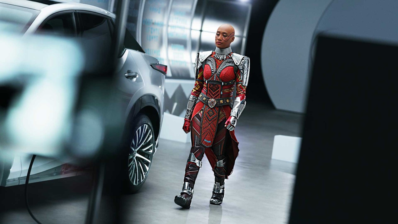A “Black Panther: Wakanda Forever” actress walking past a Lexus RZ 450e